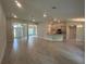 Spacious living room and kitchen area with recessed lighting and modern finishes at 27462 Pasto Dr, Punta Gorda, FL 33983