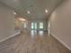 Open-concept living room featuring tile flooring and ample natural light at 27462 Pasto Dr, Punta Gorda, FL 33983