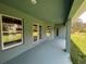 Covered patio with windows overlooking the backyard at 27462 Pasto Dr, Punta Gorda, FL 33983