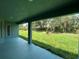 View of the backyard from the covered patio area, perfect for outdoor relaxation and entertaining at 27462 Pasto Dr, Punta Gorda, FL 33983