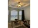 Home office boasts built-in shelving and plenty of natural light at 5101 Pine Shadow Ln, North Port, FL 34287