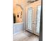 Bright entryway with double doors and decorative glass at 5101 Pine Shadow Ln, North Port, FL 34287