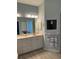 Double vanity bathroom with a walk-in shower at 5101 Pine Shadow Ln, North Port, FL 34287