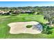 Aerial of golf course sand trap and surrounding landscape at 5101 Pine Shadow Ln, North Port, FL 34287