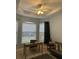 Home office boasts built-in shelving and plenty of natural light at 5101 Pine Shadow Ln, North Port, FL 34287