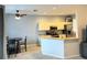 Kitchen with breakfast bar and stainless steel appliances at 5101 Pine Shadow Ln, North Port, FL 34287