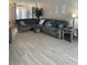 Spacious living room featuring a large sectional sofa at 5101 Pine Shadow Ln, North Port, FL 34287