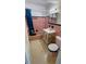 Pink bathroom with shower/tub combo and vanity at 554 Lindley Ter, Port Charlotte, FL 33952