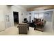 Bright and airy living room with comfortable seating and a view to the kitchen at 554 Lindley Ter, Port Charlotte, FL 33952