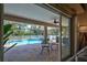 Inviting screened pool area with ample seating at 5644 Cissus Ave, North Port, FL 34288