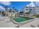 Inviting community pool area with adjacent bathhouse at 1250 W Marion Ave # 122, Punta Gorda, FL 33950