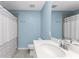 Light blue bathroom with a shower/tub and white vanity at 14151 Heritage Landing Blvd # 1021, Punta Gorda, FL 33955