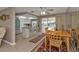 Dining room includes breakfast bar, modern lighting, ceiling fan, and sliding glass doors to porch at 201 W Tarpon Nw Blvd, Port Charlotte, FL 33952