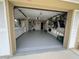 Spacious garage with epoxy flooring, ample storage, and workshop area at 201 W Tarpon Nw Blvd, Port Charlotte, FL 33952