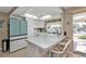 Charming kitchen with white cabinets, breakfast bar and waterfront views at 201 W Tarpon Nw Blvd, Port Charlotte, FL 33952