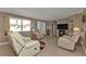 Bright living room featuring tile floors, comfortable seating, and ample natural light at 201 W Tarpon Nw Blvd, Port Charlotte, FL 33952