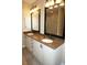 Double vanity bathroom with granite countertop at 2620 Tarpon Cove Dr # 311, Punta Gorda, FL 33950