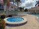 Relaxing community spa with blue cover at 2620 Tarpon Cove Dr # 311, Punta Gorda, FL 33950