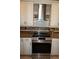 Modern stainless steel oven and cooktop with stylish backsplash at 2620 Tarpon Cove Dr # 311, Punta Gorda, FL 33950