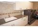 Laundry room with washer, dryer, utility sink, and ample storage at 2620 Tarpon Cove Dr # 311, Punta Gorda, FL 33950