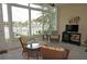 Relaxing sunroom with wicker furniture and canal views at 2620 Tarpon Cove Dr # 311, Punta Gorda, FL 33950