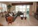 Living area with leather sofas, a coffee table, and water views at 2620 Tarpon Cove Dr # 311, Punta Gorda, FL 33950