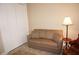Small sitting room with sofa and built-in shelving at 2620 Tarpon Cove Dr # 311, Punta Gorda, FL 33950