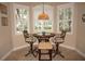 Charming breakfast nook with a tiled table and built-in seating at 2620 Tarpon Cove Dr # 311, Punta Gorda, FL 33950