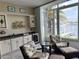 Outdoor kitchen with granite countertops and mini-fridge at 2620 Tarpon Cove Dr # 311, Punta Gorda, FL 33950