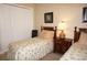 Bedroom with twin beds, nightstand, and closet at 2620 Tarpon Cove Dr # 311, Punta Gorda, FL 33950