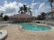 Inviting community pool with surrounding patio at 2620 Tarpon Cove Dr # 311, Punta Gorda, FL 33950