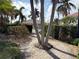 Community pool and spa with lounge chairs and patio area at 2620 Tarpon Cove Dr # 311, Punta Gorda, FL 33950