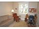 Home office features a comfortable sitting area, desk, and large window at 2620 Tarpon Cove Dr # 311, Punta Gorda, FL 33950
