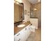 Bathroom boasts granite vanity, tiled shower, and updated fixtures at 2620 Tarpon Cove Dr # 311, Punta Gorda, FL 33950
