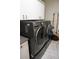 Bright laundry room with LG washer and dryer, and extra storage at 2620 Tarpon Cove Dr # 311, Punta Gorda, FL 33950