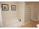 Bathroom with soaking tub and glass block shower at 2620 Tarpon Cove Dr # 311, Punta Gorda, FL 33950