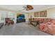 Living area featuring comfortable seating and a large TV at 3736 Bordeaux Dr, Punta Gorda, FL 33950