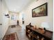 Bright and airy entryway with tile flooring and a console table at 632 Rose Apple Cir, Port Charlotte, FL 33954