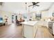 Spacious kitchen featuring white cabinets, stainless steel appliances, and an island at 632 Rose Apple Cir, Port Charlotte, FL 33954