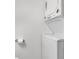 Compact laundry room with stackable washer and dryer at 6450 Floral Ct, North Port, FL 34287