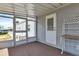 Covered porch with screened enclosure, providing outdoor space at 6450 Floral Ct, North Port, FL 34287