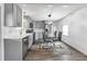 Modern kitchen with gray cabinets and stainless steel appliances at 6450 Floral Ct, North Port, FL 34287