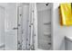 Clean bathroom with shower, white walls, and butterfly-themed curtain at 6450 Floral Ct, North Port, FL 34287