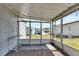 Covered screened porch overlooking the backyard at 6450 Floral Ct, North Port, FL 34287