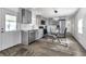 Modern kitchen with gray cabinets, stainless steel appliances and white backsplash at 6450 Floral Ct, North Port, FL 34287