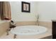Relaxing bathtub with tiled surround, perfect for unwinding at 88 Vivante Blvd # 8845/405, Punta Gorda, FL 33950