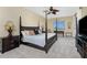 Spacious Primary bedroom with a post bed and TV at 88 Vivante Blvd # 8845/405, Punta Gorda, FL 33950