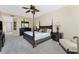 Main bedroom with a post bed, ceiling fan and ample space at 88 Vivante Blvd # 8845/405, Punta Gorda, FL 33950