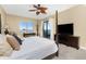 Primary bedroom with a king-size bed and private balcony access at 88 Vivante Blvd # 8845/405, Punta Gorda, FL 33950