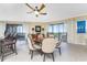 Bright dining room featuring a round table and six chairs with balcony access at 88 Vivante Blvd # 8845/405, Punta Gorda, FL 33950